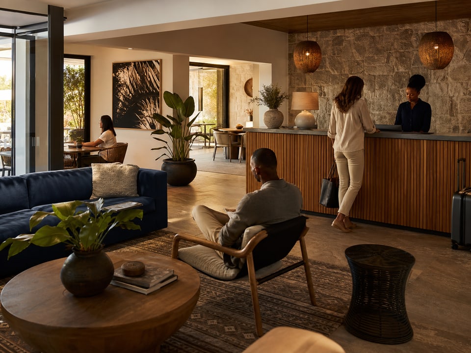 Guests dining in a warmly lit hospitality venue
